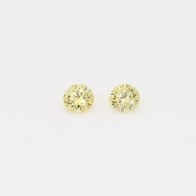 0.12 Total carat pair of round cut yellow diamonds