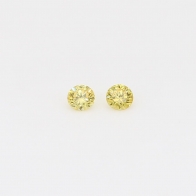 0.08 Total carat pair of round cut yellow diamonds
