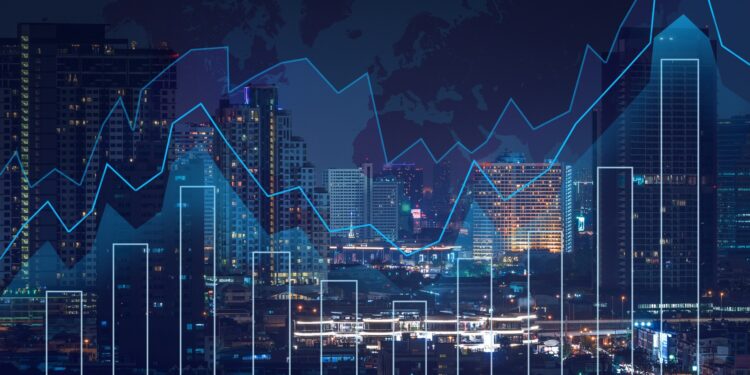 Trading graph on the cityscape at night and world map background,Business financial concept